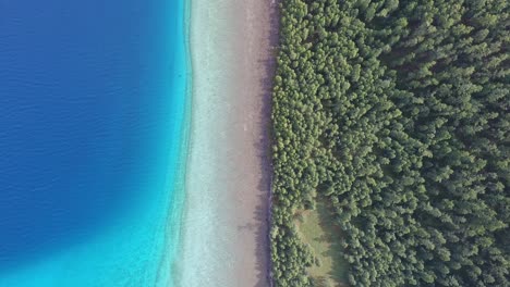 Aerial-drone-shot-from-top-view-border-forest-beach-lake-khuvsgul-in-Mongolia